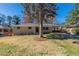 Charming brick home with a well-maintained front lawn and a large tree in the center at 2167 Kilarney Rd, Decatur, GA 30032