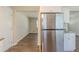 Modern kitchen featuring stainless steel appliances and white cabinets with views into the dining room at 2167 Kilarney Rd, Decatur, GA 30032
