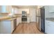 Stylish kitchen with granite countertops, stainless steel appliances, and modern white cabinetry at 2167 Kilarney Rd, Decatur, GA 30032