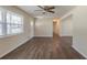 Bright living room featuring updated flooring, fresh paint, and ample natural light from a large window at 2167 Kilarney Rd, Decatur, GA 30032