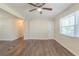 Spacious and bright living room with new flooring and a ceiling fan for added comfort at 2167 Kilarney Rd, Decatur, GA 30032