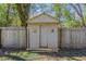 Exterior of a shed in backyard with wooden fence at 2167 Kilarney Rd, Decatur, GA 30032