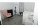 Cozy bedroom with pink rocking chair, white crib and changing table at 2744 Snapfinger Mnr, Decatur, GA 30035