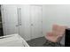 This cozy Bedroom bedroom is painted white and features a comfortable rocking chair at 2744 Snapfinger Mnr, Decatur, GA 30035