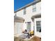 Cozy patio space for relaxing, featuring chairs, a small table, and convenient access to the home at 2744 Snapfinger Mnr, Decatur, GA 30035