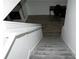 Carpeted staircase leads to a lower level featuring wood floors and an office space at 2744 Snapfinger Mnr, Decatur, GA 30035