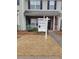 Home exterior with 'For Sale' sign, brick accents, and mulched yard at 2744 Snapfinger Mnr, Decatur, GA 30035