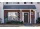 Charming townhouse with a brick facade, covered entry, and black front door at 2744 Snapfinger Mnr, Decatur, GA 30035