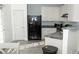 Bright kitchen with white cabinets, black appliances, and a view of the yard at 2744 Snapfinger Mnr, Decatur, GA 30035