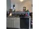 Kitchen with sink and white cabinets, set up with bar seating, and dark countertops at 2744 Snapfinger Mnr, Decatur, GA 30035