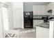 Well-lit kitchen featuring modern appliances, white cabinets, and attractive countertops at 2744 Snapfinger Mnr, Decatur, GA 30035