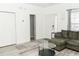 Inviting living room with a large, comfortable sofa and neutral decor at 2744 Snapfinger Mnr, Decatur, GA 30035