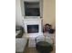 Bright living room with a fireplace, large TV, and grey, comfortable seating at 2744 Snapfinger Mnr, Decatur, GA 30035