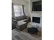 Cozy living room featuring a comfortable sectional sofa and a fireplace with mounted TV at 2744 Snapfinger Mnr, Decatur, GA 30035