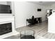 Bright and airy living room featuring a fireplace and sleek furniture at 2744 Snapfinger Mnr, Decatur, GA 30035