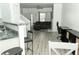 Spacious living area with hardwood floors, a kitchen bar, and views of the living room at 2744 Snapfinger Mnr, Decatur, GA 30035