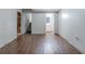 Unfinished basement with wood-look flooring, exposed ceilings, and access to bathroom and stairs at 4342 Lincolndale Dr, Ellenwood, GA 30294