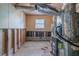 Exposed basement utilities and concrete floor offer a blank canvas for potential updates at 4342 Lincolndale Dr, Ellenwood, GA 30294