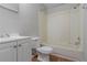 Bathroom featuring a toilet, vanity with storage, and a shower with plastic siding at 4342 Lincolndale Dr, Ellenwood, GA 30294