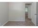 Bright bedroom with neutral walls, carpet, and an open doorway at 4342 Lincolndale Dr, Ellenwood, GA 30294