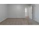 Neutral walls and carpeting with interior closet and access door create a blank canvas in this bedroom at 4342 Lincolndale Dr, Ellenwood, GA 30294