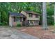 Two-story home featuring brick and siding, and front porch at 4342 Lincolndale Dr, Ellenwood, GA 30294