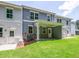 Exterior view of the backyard with a covered patio and green lawn at 4531 Moray Dr, Mableton, GA 30126