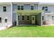 Backyard with a covered patio area and grassy lawn at 4531 Moray Dr, Mableton, GA 30126