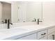 Bathroom showcasing a double vanity with black hardware, white countertops, and a large mirror at 4531 Moray Dr, Mableton, GA 30126