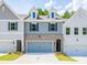 Charming townhomes with brick accents, dormer windows, and well-maintained landscaping at 4531 Moray Dr, Mableton, GA 30126