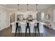 Modern kitchen with sleek appliances, large island with bar seating, and pendant lighting at 4531 Moray Dr, Mableton, GA 30126