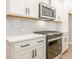 Modern kitchen with stainless steel oven, and gray subway tile backsplash at 4531 Moray Dr, Mableton, GA 30126