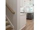 Open concept kitchen with white countertops, stainless appliances and pendant lights at 4531 Moray Dr, Mableton, GA 30126