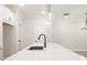 Kitchen island with black faucet and hardwood floor at 4531 Moray Dr, Mableton, GA 30126