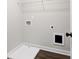 The laundry room features gray walls, wood-look flooring, and a white wire shelf at 4531 Moray Dr, Mableton, GA 30126