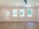 Bright living room with a ceiling fan and windows at 4531 Moray Dr, Mableton, GA 30126