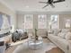 Bright living room with stylish decor, ceiling fan, and plenty of natural light at 4531 Moray Dr, Mableton, GA 30126