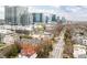 Panoramic aerial showcasing a mix of residential townhouses and high-rise buildings against a clear sky at 774 Piedmont Ne Ave # 2A, Atlanta, GA 30308