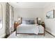 Bright and airy bedroom with a neutral color palette, stylish curtains, and a comfortable queen bed at 774 Piedmont Ne Ave # 2A, Atlanta, GA 30308