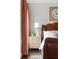 Cozy bedroom with a striking leather headboard, bedside table, and a decorative clock at 774 Piedmont Ne Ave # 2A, Atlanta, GA 30308