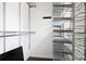 Walk-in closet with built-in metal shelving and storage solutions at 774 Piedmont Ne Ave # 2A, Atlanta, GA 30308