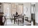 Elegant dining room with hardwood floors, stylish light fixture, and large windows for natural light at 774 Piedmont Ne Ave # 2A, Atlanta, GA 30308