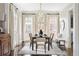 Elegant dining room with hardwood floors, stylish light fixture, and large windows for natural light at 774 Piedmont Ne Ave # 2A, Atlanta, GA 30308