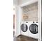 Laundry area featuring a stacked washer and dryer set within a closet at 774 Piedmont Ne Ave # 2A, Atlanta, GA 30308
