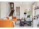 Cozy living room with stylish furniture, fireplace, and staircase at 774 Piedmont Ne Ave # 2A, Atlanta, GA 30308