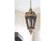 Close-up of a decorative hanging pendant light, with ornate details in a well-lit entryway at 774 Piedmont Ne Ave # 2A, Atlanta, GA 30308