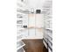 Organized walk-in closet with metal shelving, hanging rods, and ample storage space for clothes and accessories at 774 Piedmont Ne Ave # 2A, Atlanta, GA 30308