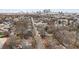 Aerial view of neighborhood with mature trees and the city skyline in the distance at 789 Cooper Sw St, Atlanta, GA 30315