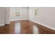 Bright bedroom featuring hardwood floors, two windows, and neutral decor for a cozy and inviting space at 789 Cooper Sw St, Atlanta, GA 30315