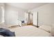 Cozy bedroom with neutral tones, hardwood floors, and a comfortable chair for a relaxing retreat at 789 Cooper Sw St, Atlanta, GA 30315